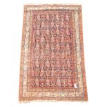 Persian rug, blue ground field decorated with repeating Boteh motifs,