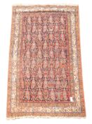 Persian rug, blue ground field decorated with repeating Boteh motifs,