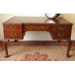 20th century mahogany reverse break front writing desk, inset brown leather writing surface,