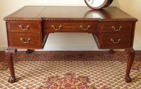 20th century mahogany reverse break front writing desk, inset brown leather writing surface,
