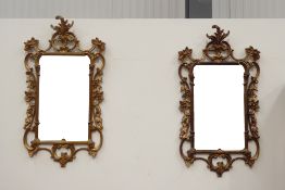 Pair of decorative reproduction gilt framed wall mirrors, with scrolling and floral design,