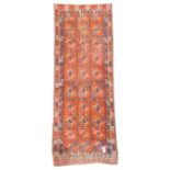 Afghan red and blue ground rug, geometric repeating field with camel motif boarder,