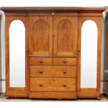 Victorian mahogany break front triple wardrobe, projecting cornice above two paneled doors,