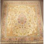 Large Indian beige ground rug, central medallion, stylised floral design on beige field,