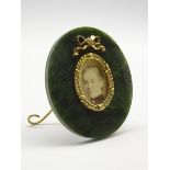 Moss agate oval miniature frame with gilded wreath and tied bow decoration on an easel stand 7.