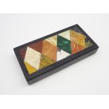 Pietra dura plaque inlaid with coloured hardstones in a geometric design 9cm x 17cm