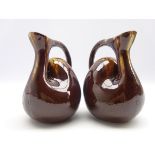 Pair of pottery camel hump jugs in the style of Christopher Dresser with incised band of rosettes