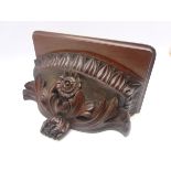 Victorian mahogany wall bracket carved with flower head,