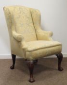 19th century walnut framed wing back armchair, upholstered in cream damask,