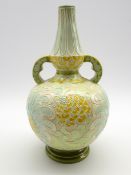 Burmantofts Faience two handled vase with an incised floral design in yellow,