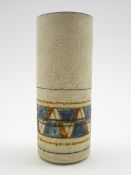 Troika pottery cylindrical vase by Annette Walters with geometric design in blue and brown on a