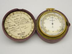 Compensated pocket barometer with compass to the reverse with gilt metal case and outer leather
