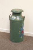 Large aluminum milk churn, painted with floral design on green background,