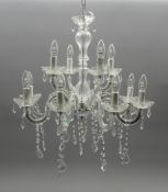 Crystal chandelier with nine branches, candle scones and faceted glass drops,