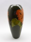 Walter Moorcroft oviform vase decorated with Hibiscus pattern on a green ground,