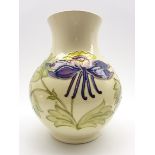 Walter Moorcroft baluster vase decorated with purple Columbine on a cream ground,