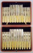 Set of 12 dessert knives and forks with engraved blades and bone handles, cased.