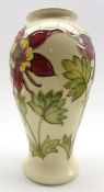 Walter Moorcroft oviform vase decorated with red Columbine pattern on a cream ground,