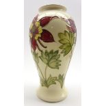 Walter Moorcroft oviform vase decorated with red Columbine pattern on a cream ground,