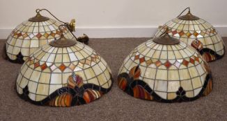 Set of four Tiffany style leaded glass hanging light fittings,