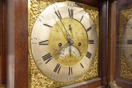 18th century oak longcase clock, sarcophagus top over projecting cornice,