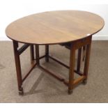 Edwardian mahogany gate leg dining table, oval top, drawer to each end,
