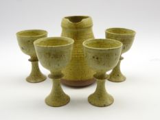 David Llloyd Jones (1928-1994) studio pottery jug H20cm and four goblets,