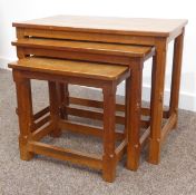 Nest of three Robert 'Mouseman' Thompson adzed oak tables, each with octagonal supports,