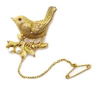 9ct gold brooch in the form of a wren with a ruby eye on a branch set with pearls,