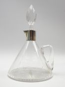 Edwardian glass ships decanter with loop handle and star cut base with silver collar Birmingham