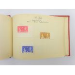 Red album 'Coronation Stamps May 1937' containing various stamps issued to commemorate the Coronati