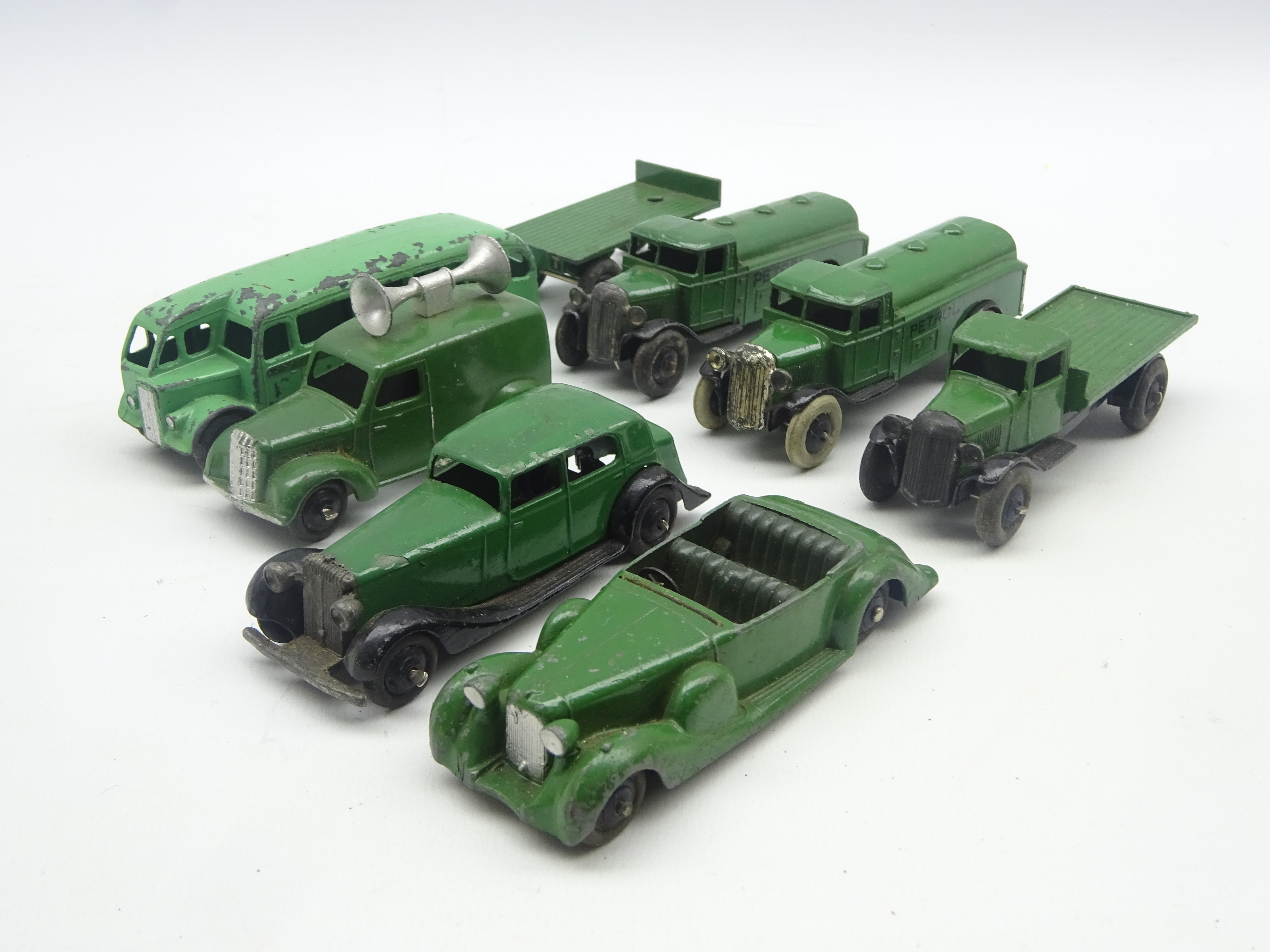 Dinky - eight unboxed and playworn early die-cast models including Lagonda 4-seat sports car,