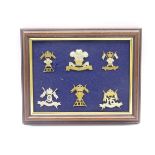 Six mounted and framed cap badges for 12th Lancers, 12th Royal Lancers, 9th-12th Lancers,