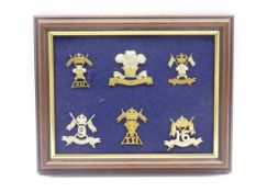 Six mounted and framed cap badges for 12th Lancers, 12th Royal Lancers, 9th-12th Lancers,