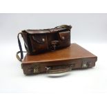 Stitched leather cartridge bag of oblong form with two pouch compartments to the front and carrying