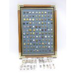 Framed display of over one hundred and twenty military and livery buttons and quantity of loose