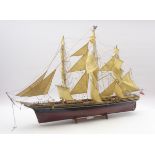 Model of the three masted clipper ship 'Cutty Sark', with black and brown painted wooden hull,