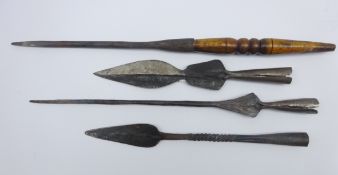Four native hand made iron spear heads, various sizes and designs,