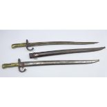Two French Model 1866 Sabre bayonets, each with curving fullered steel blade,