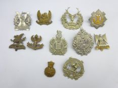 Five Scottish Glengarry badges and six cap badges including Argyll & Sutherland, Tyneside Scottish,