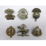 Six cap badges - Royal Munster Fusiliers, Beds & Herts Regiment, Leinster Regiment, East Lancashire,