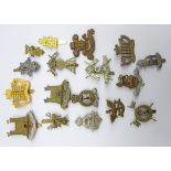 Seventeen cap badges comprising nine Hussars,