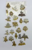 Twenty-three cap badges for various regiments including Warwickshire, Norfolk, Royal Lincolnshire,