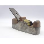 Woodworking coffin shaped smoothing plane with steel body and wooden infill, cap iron marked A.