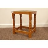 'Mouseman' Yorkshire oak stool by Robert Thompson of Kilburn, with needlework upholstered seat,