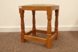 'Mouseman' Yorkshire oak stool by Robert Thompson of Kilburn, with needlework upholstered seat,