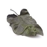 Bronze of a lizard on a leaf,