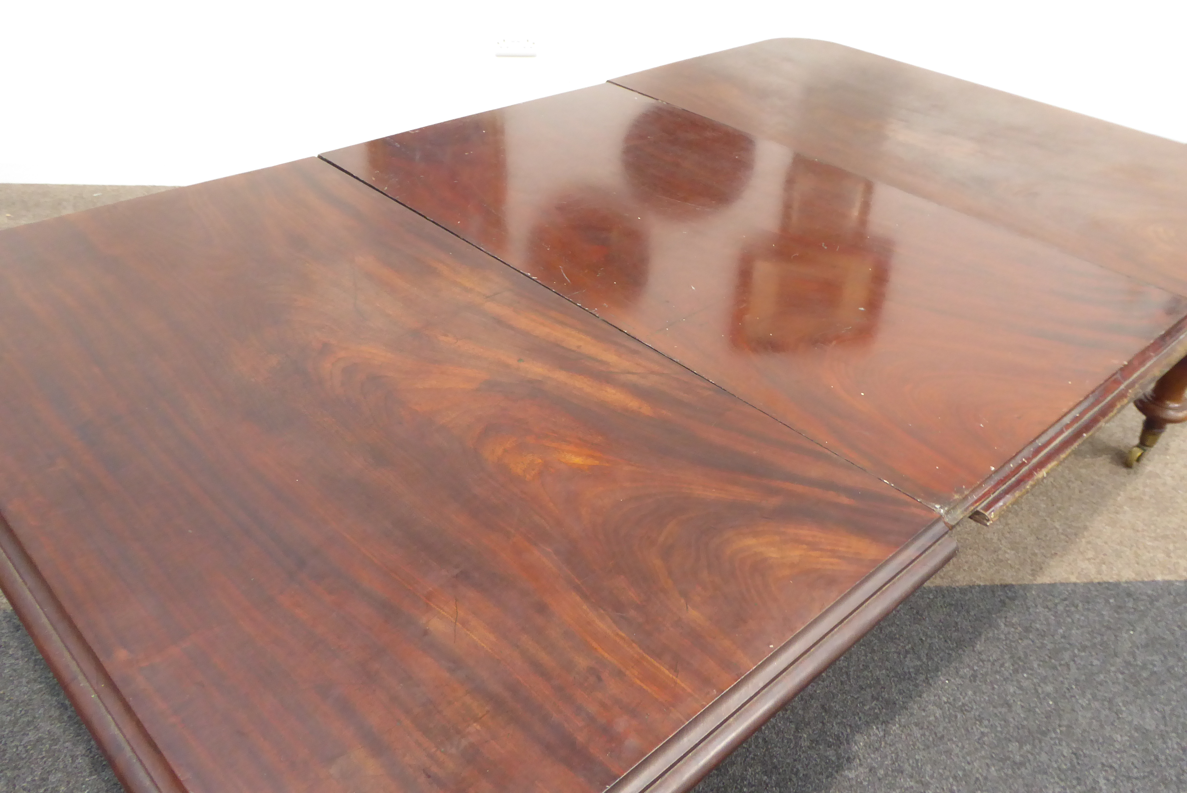 Large Victorian mahogany extending dining table, rectangular moulded top having rounded corners, - Image 2 of 5