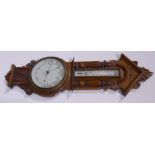 Early 20th century carved oak cased aneroid barometer with mercury thermometer, signed 'John Dyson,