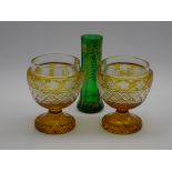 Pair of Bohemian amber flashed cut glass goblet shape vases on a pedestal foot H12cm and a green
